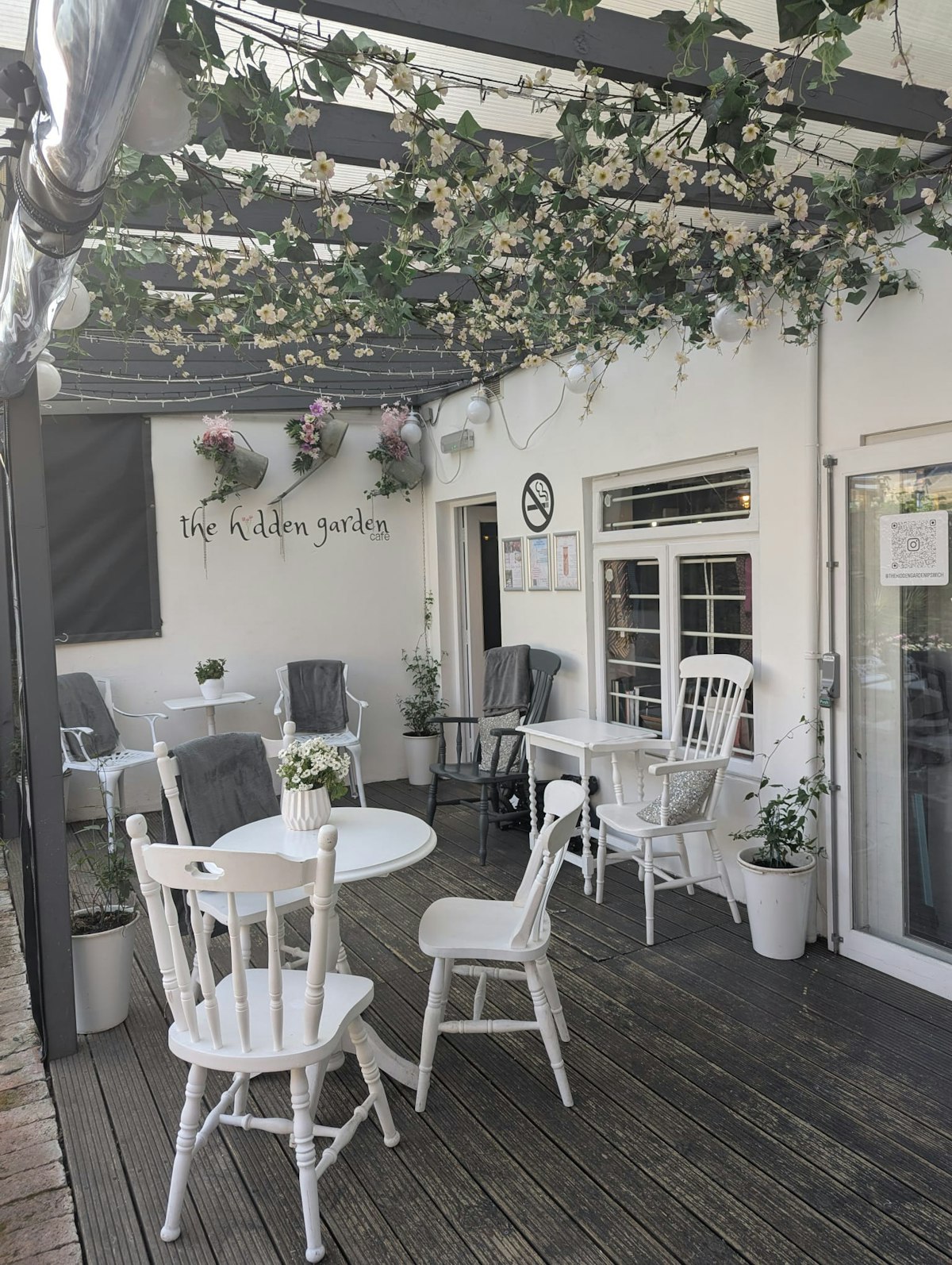 The pretty decked seating area overlooking The Hidden Garden